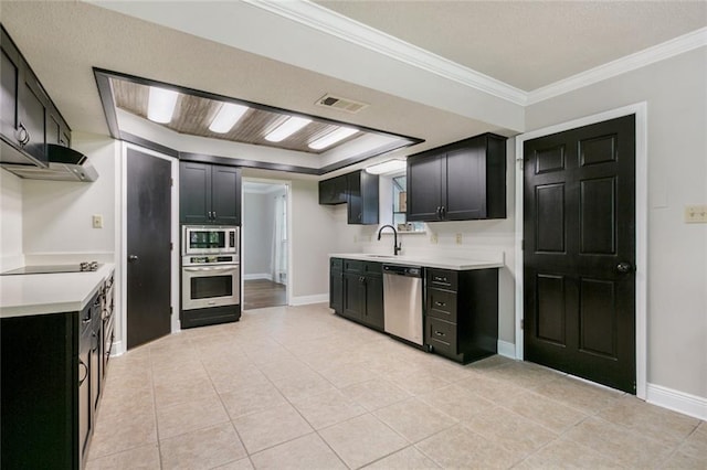 kitchen featuring sink, crown molding, stainless steel appliances, and light tile patterned floors