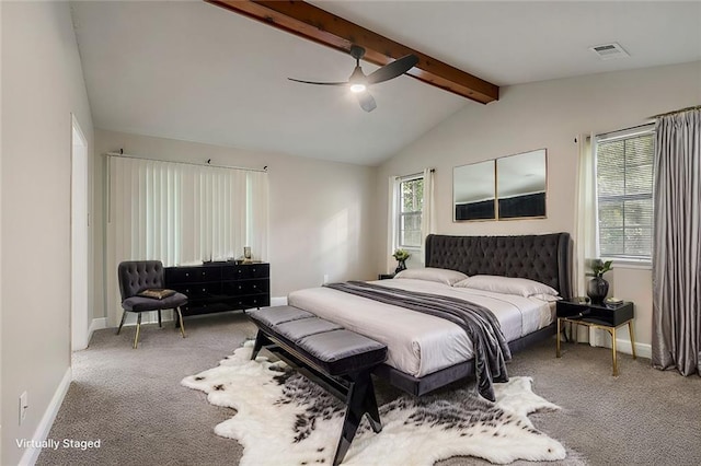 carpeted bedroom featuring lofted ceiling with beams and ceiling fan