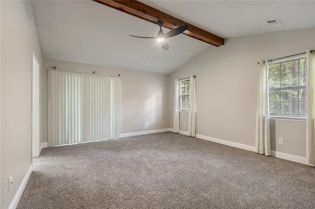 unfurnished room with vaulted ceiling with beams, carpet floors, and ceiling fan