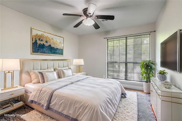 bedroom featuring ceiling fan and light wood-type flooring