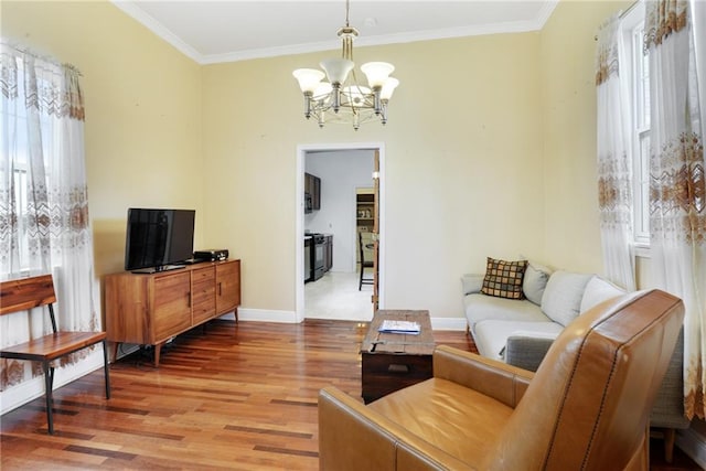 living room with hardwood / wood-style floors, crown molding, and plenty of natural light