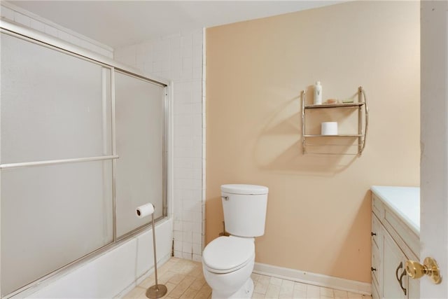 full bathroom featuring vanity, shower / bath combination with glass door, and toilet