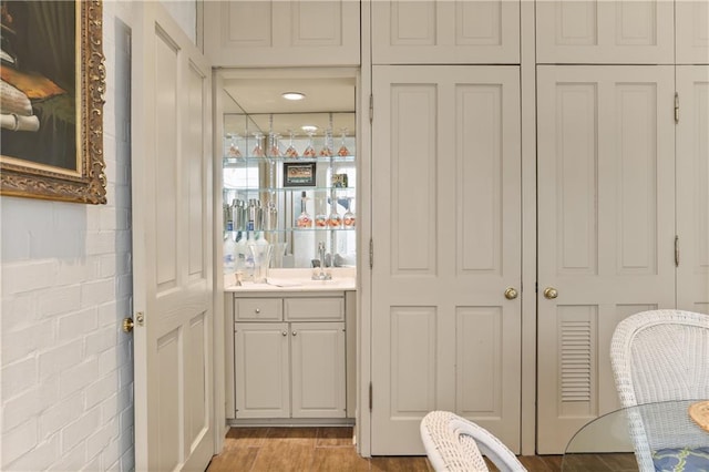 bathroom with vanity and wood-type flooring