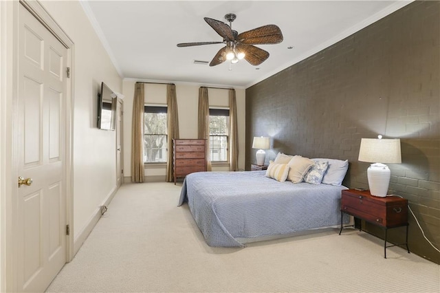 carpeted bedroom featuring crown molding, brick wall, and ceiling fan