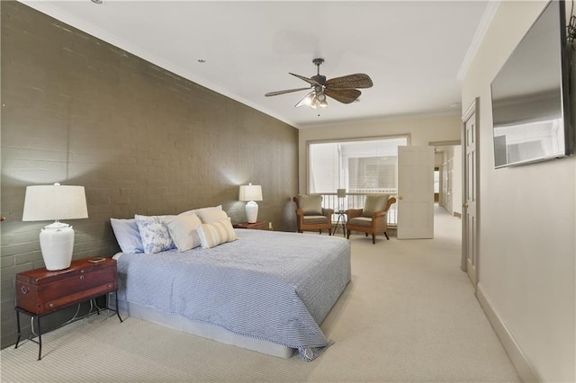 carpeted bedroom with crown molding and ceiling fan