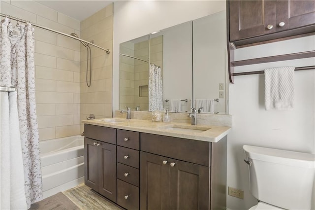 full bathroom featuring vanity, toilet, and shower / bath combo