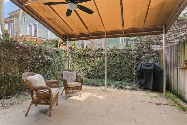 view of patio with grilling area and ceiling fan