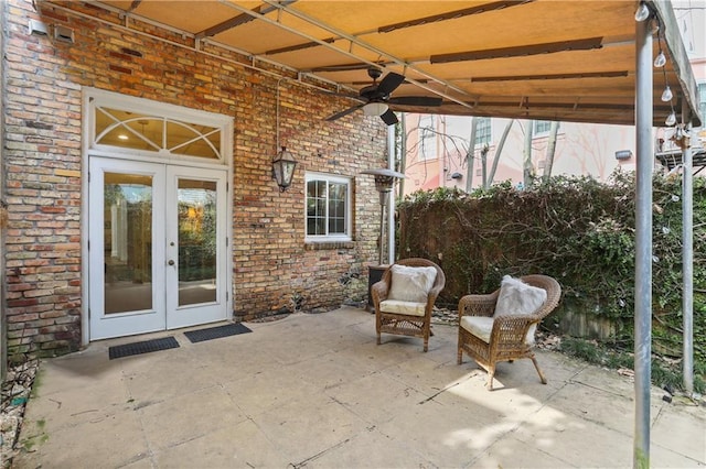 patio terrace at dusk with ceiling fan and french doors