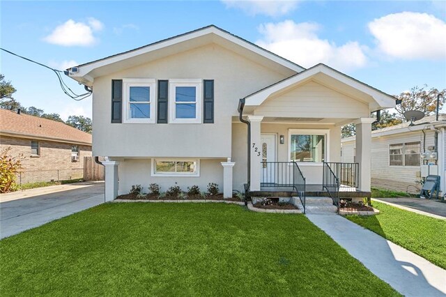 view of front of house featuring a front yard and a porch