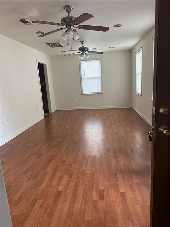 empty room featuring wood-type flooring