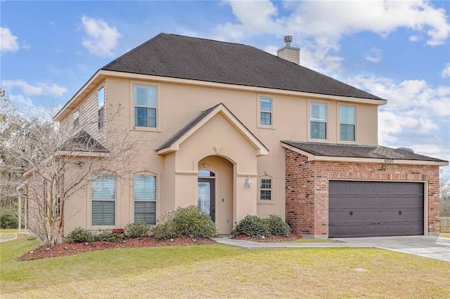 front of property with a garage and a front lawn