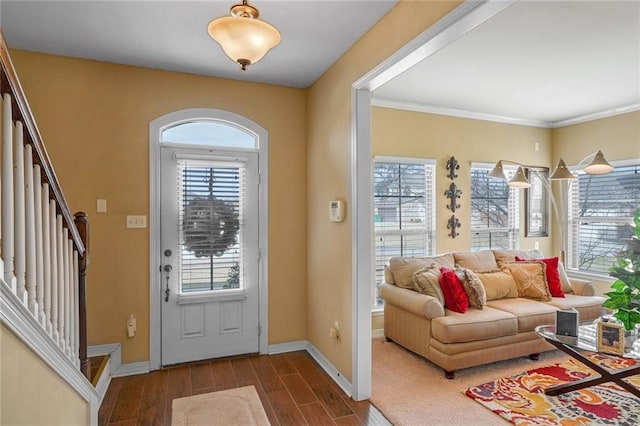 entrance foyer featuring crown molding