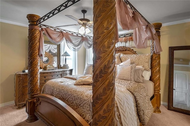 bedroom with ceiling fan, ornamental molding, and light colored carpet