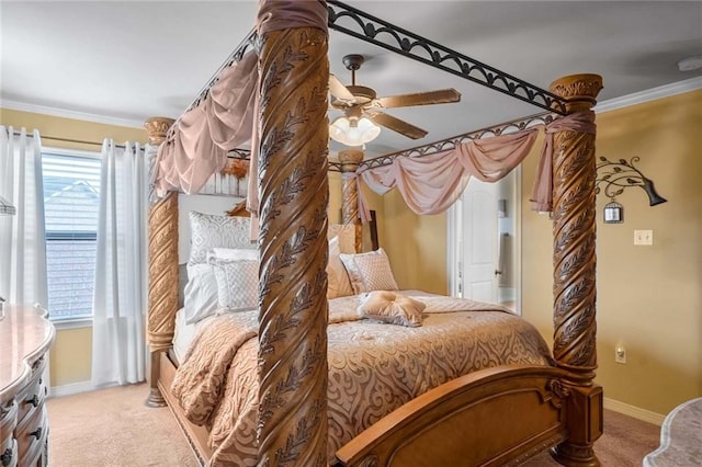 bedroom featuring multiple windows, ornamental molding, light colored carpet, and ceiling fan