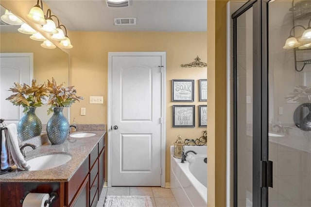 bathroom with tile patterned flooring, vanity, and independent shower and bath