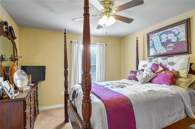 bedroom with light colored carpet and ceiling fan