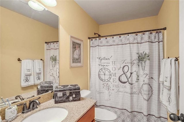 bathroom with vanity, a shower with curtain, and toilet