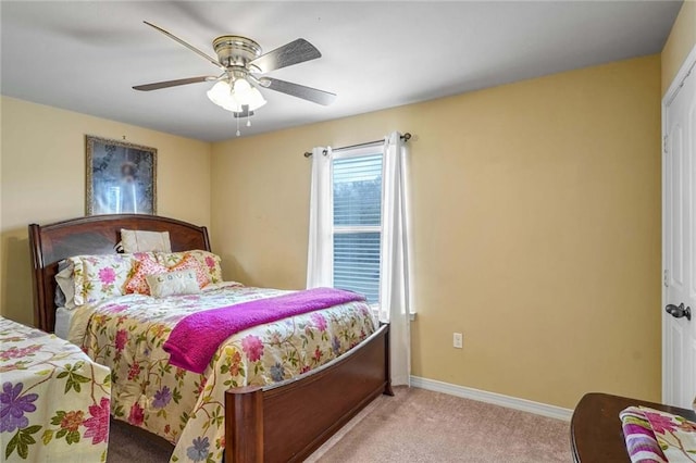 bedroom featuring ceiling fan and light colored carpet