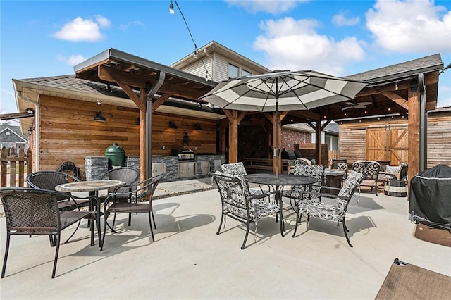 view of patio / terrace featuring exterior kitchen and grilling area