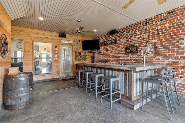 view of patio / terrace with an outdoor bar and ceiling fan