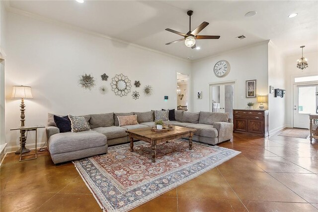 tiled living room with ornamental molding and ceiling fan with notable chandelier