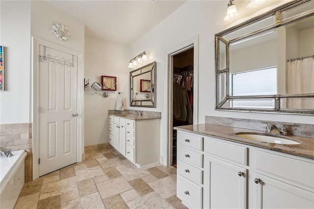 bathroom with vanity and a bathing tub