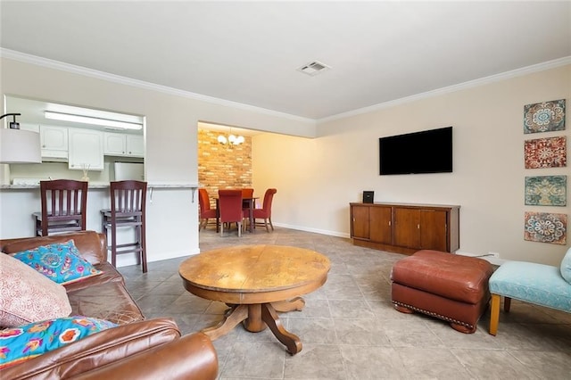 tiled living room with a notable chandelier and ornamental molding