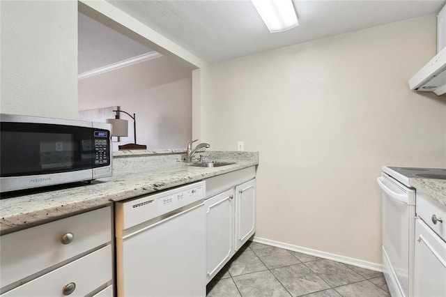 kitchen featuring sink, white appliances, light tile patterned floors, white cabinetry, and light stone counters