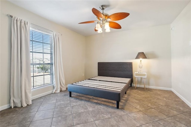 sitting room with light tile patterned floors and ceiling fan