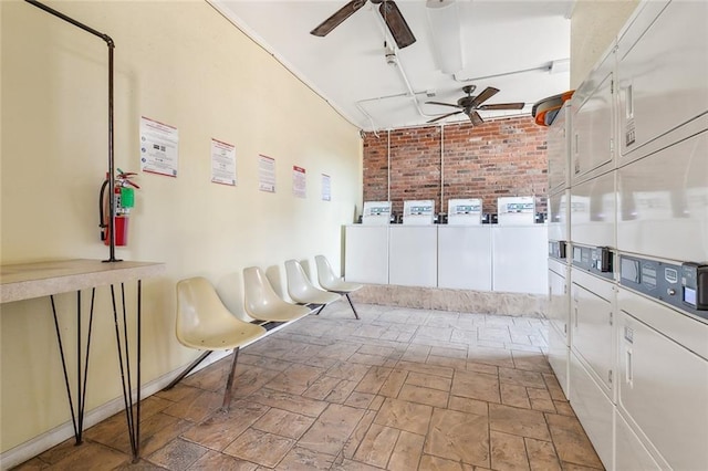 washroom with ceiling fan, stacked washer / drying machine, separate washer and dryer, and brick wall