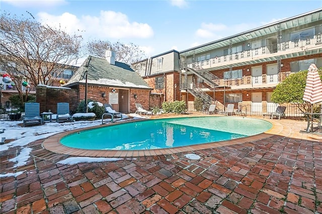 view of swimming pool featuring a patio area