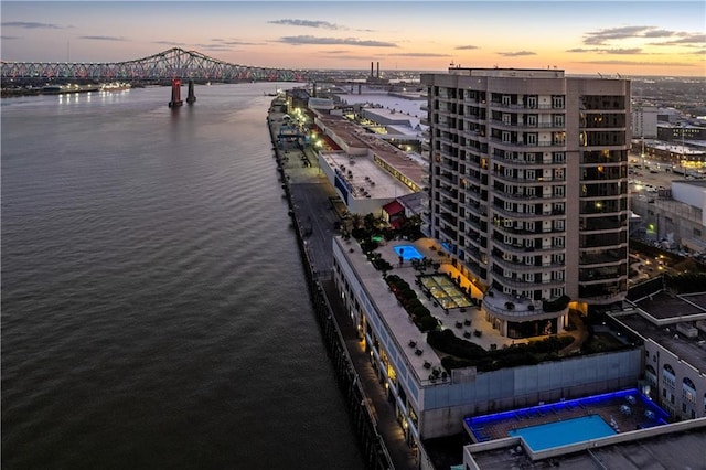 aerial view at dusk with a water view