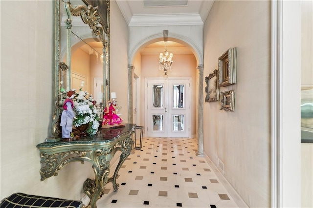 hallway featuring ornamental molding, light tile patterned flooring, a chandelier, and french doors