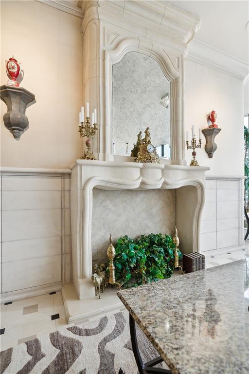 bathroom featuring tile patterned flooring and crown molding