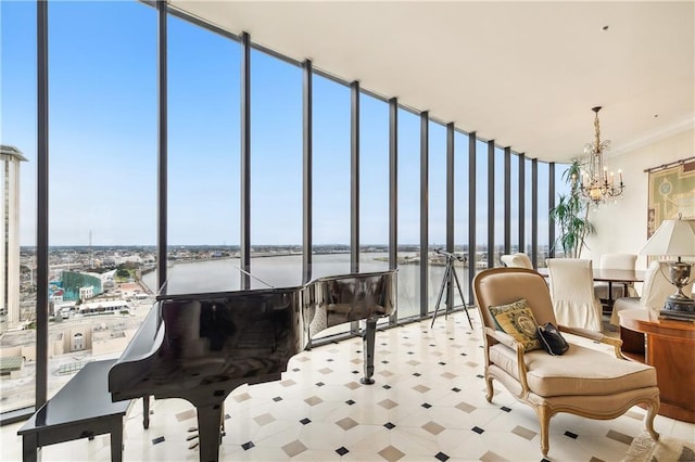 interior space featuring a notable chandelier and a water view