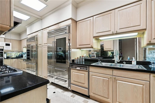 kitchen with sink, crown molding, light brown cabinets, appliances with stainless steel finishes, and range hood