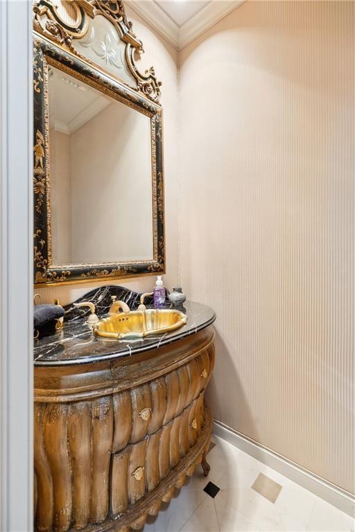 bathroom featuring vanity, ornamental molding, and tile patterned floors