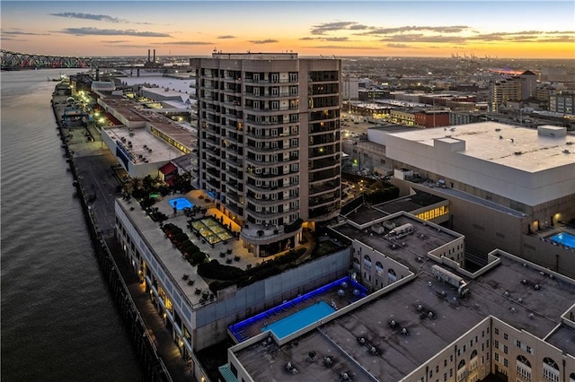 aerial view at dusk with a water view