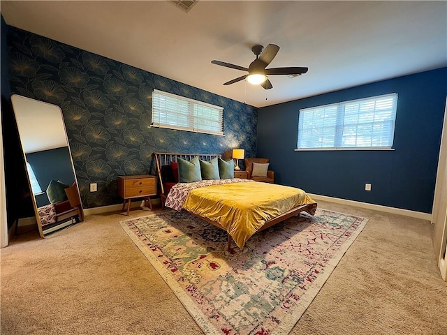 5122 Pratt Dr, New Orleans, LA 70122 - carpeted bedroom featuring baseboards, wallpapered walls, and ceiling fan