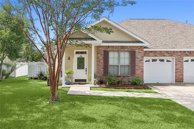 view of front facade with a garage and a front lawn