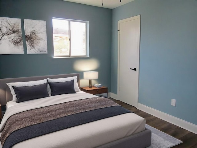 bedroom featuring dark wood-type flooring