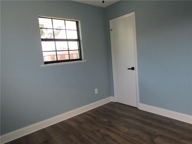 empty room featuring dark hardwood / wood-style floors