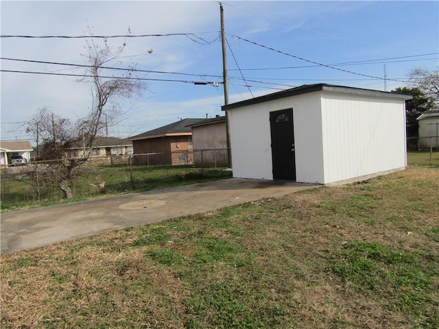 view of outdoor structure featuring a lawn