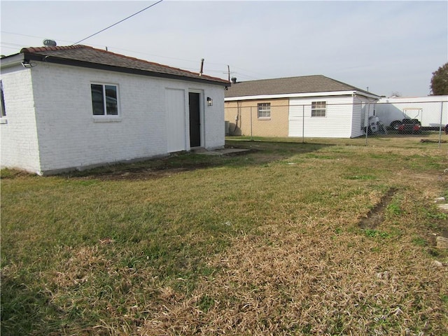 back of property with a yard