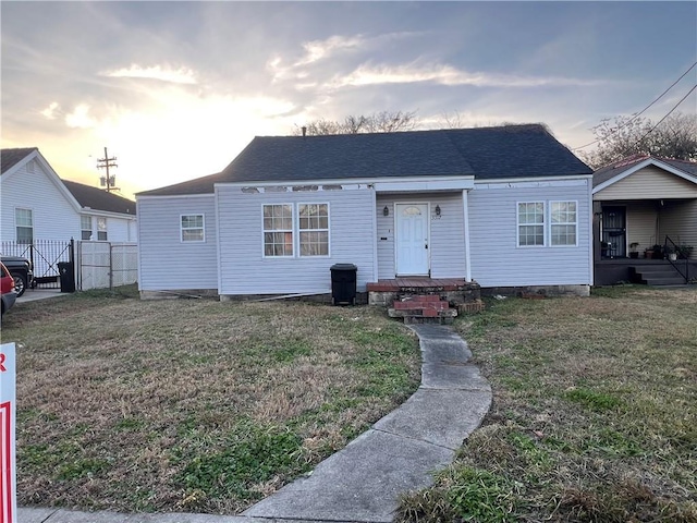 bungalow-style home featuring a lawn