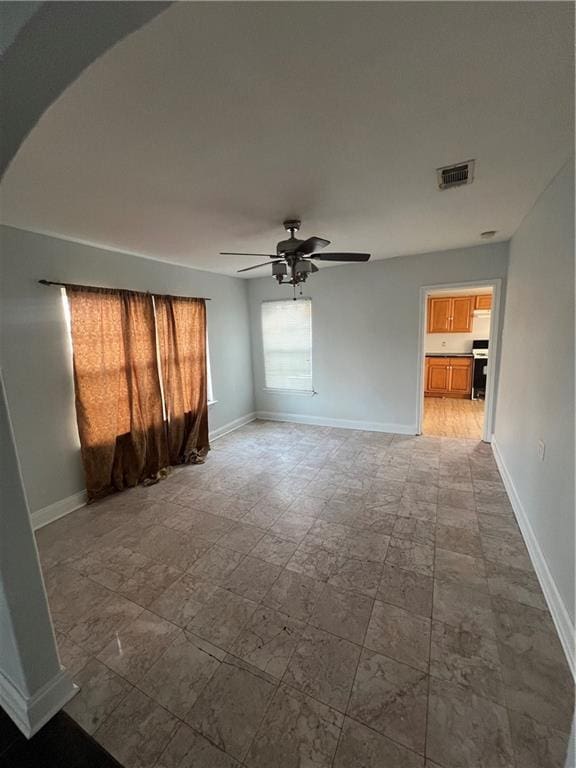 spare room featuring ceiling fan