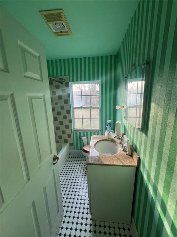 full bathroom with vanity, shower / bathing tub combination, and toilet