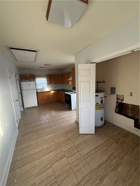 kitchen with water heater and white appliances