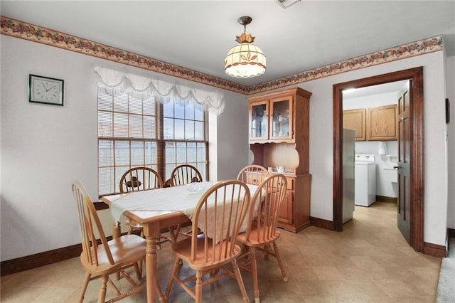 dining room featuring washer / dryer