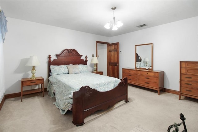 bedroom with light carpet and an inviting chandelier